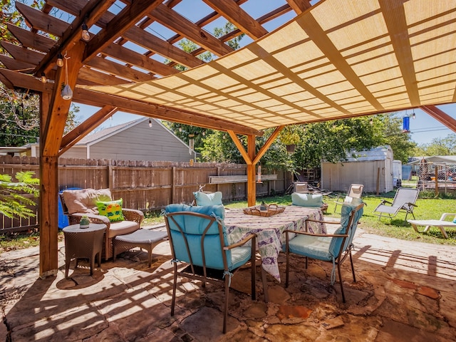 view of patio / terrace with a pergola and a shed