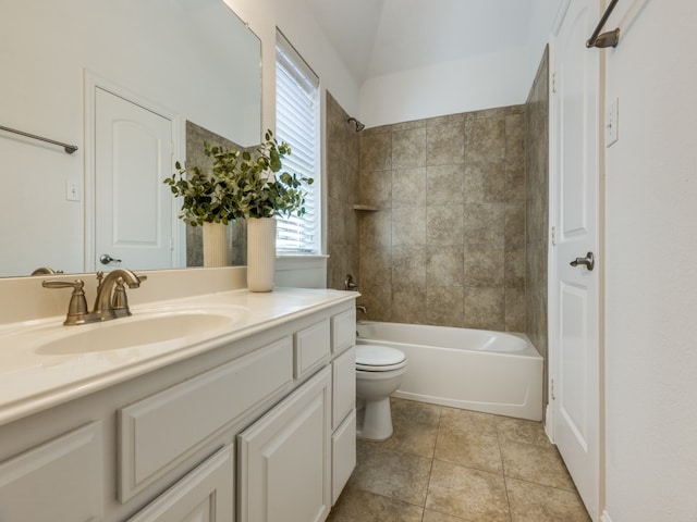 full bathroom with toilet, tiled shower / bath, and vanity