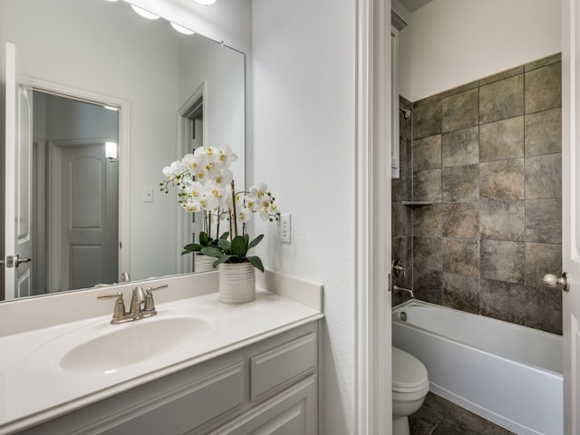 full bathroom featuring vanity, washtub / shower combination, and toilet