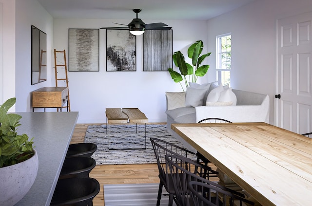 living room featuring hardwood / wood-style flooring and ceiling fan