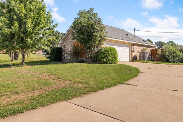 view of front of home featuring a garage and a front yard