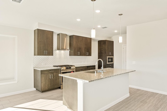 kitchen featuring dark brown cabinetry, light stone countertops, vaulted ceiling, and black microwave