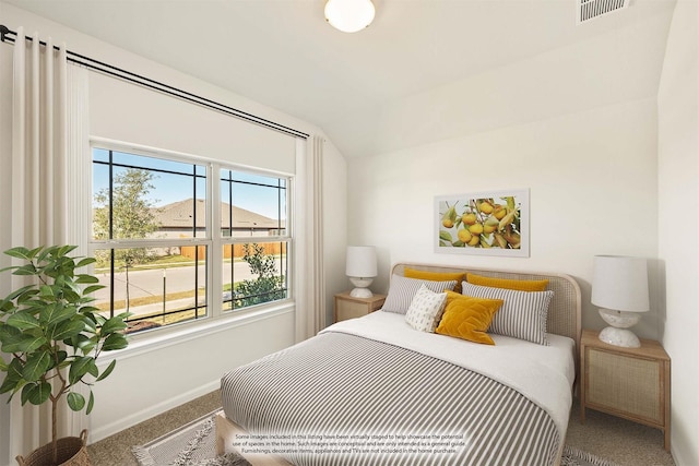 bedroom featuring vaulted ceiling and carpet