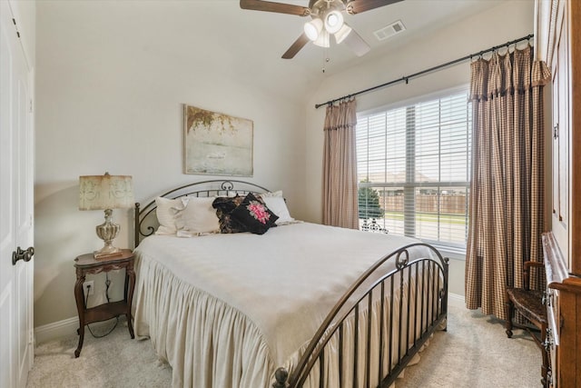 bedroom with ceiling fan, lofted ceiling, and light carpet