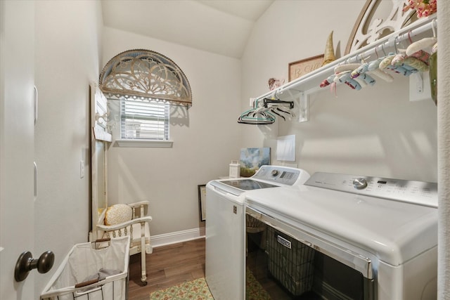 laundry room with hardwood / wood-style flooring and washing machine and clothes dryer