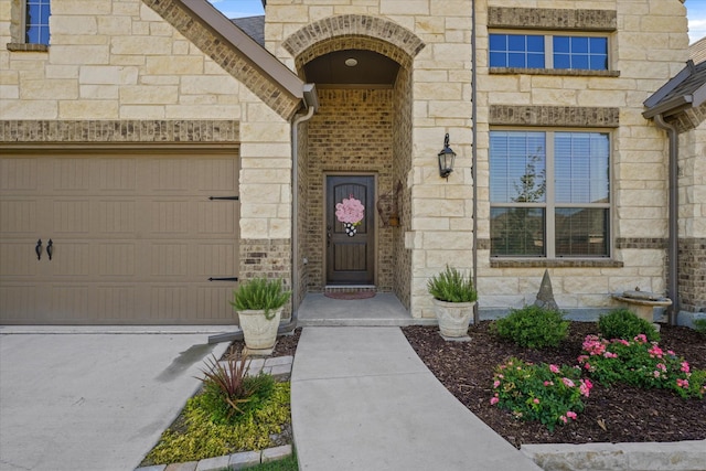 doorway to property featuring a garage