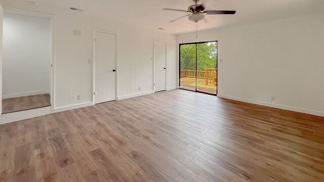 spare room featuring ceiling fan and light wood-type flooring