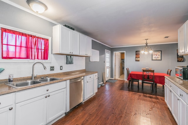 kitchen with dark hardwood / wood-style floors, crown molding, stainless steel appliances, sink, and white cabinets