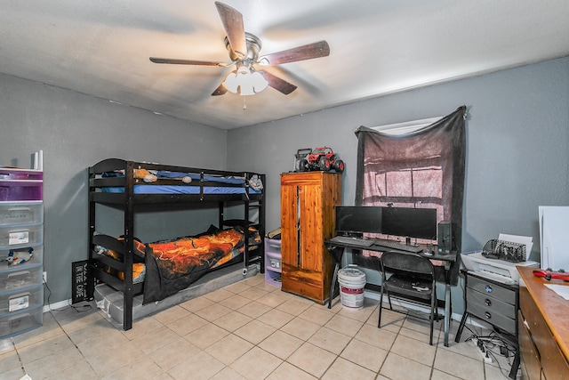 tiled bedroom with ceiling fan