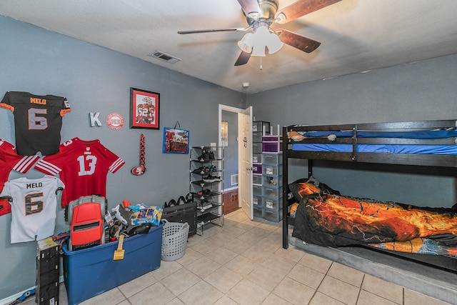 bedroom featuring light tile patterned floors and ceiling fan