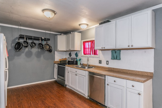 kitchen with tasteful backsplash, stainless steel appliances, sink, dark wood-type flooring, and white cabinets