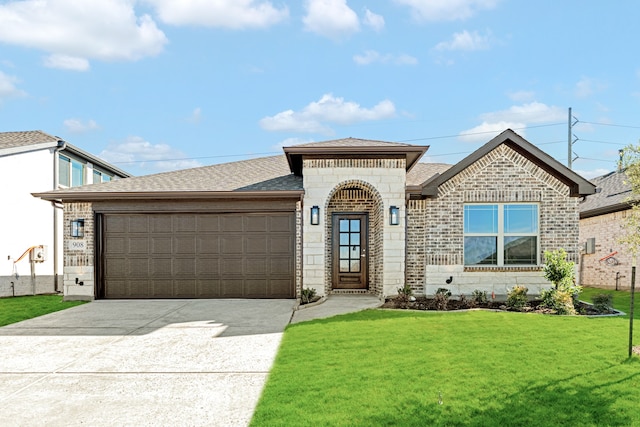 view of front of house with a garage and a front yard