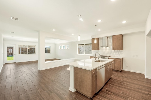 908 Alder Dr, Lavon, TX 75166 - kitchen with stainless steel dishwasher, dark wood-style floors, open floor plan, brown cabinetry, and recessed lighting