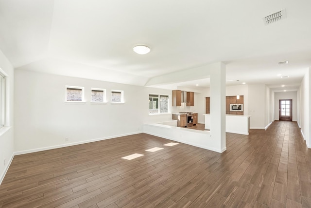 unfurnished living room with dark hardwood / wood-style floors