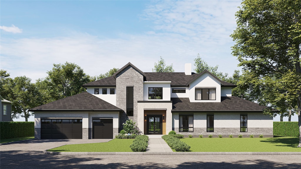 view of front of property featuring a garage and a front yard