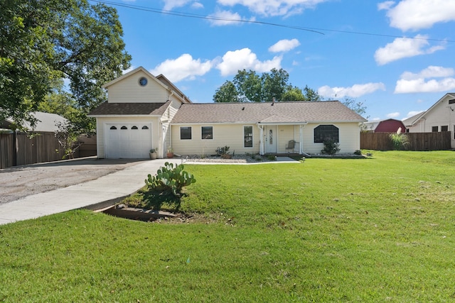 view of front of house with a garage and a front yard