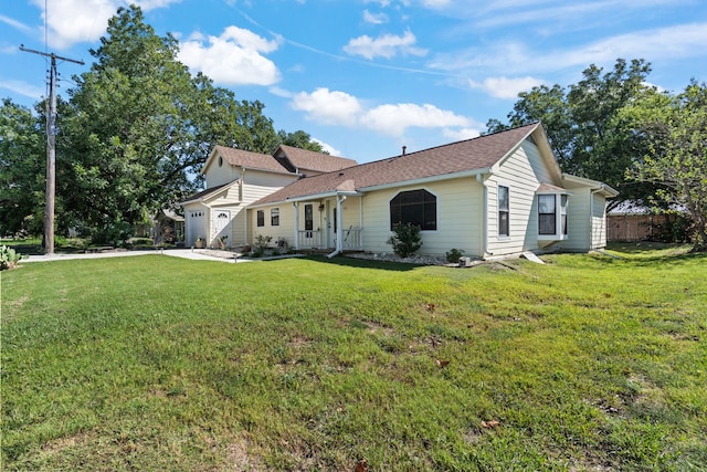 view of front of house with a garage and a front lawn