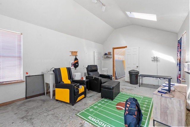 805 S 3rd St, Grandview, TX 76050 - game room featuring vaulted ceiling with skylight and concrete floors
