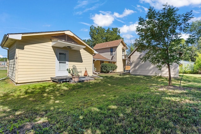 805 S 3rd St, Grandview, TX 76050 - rear view of property featuring a lawn