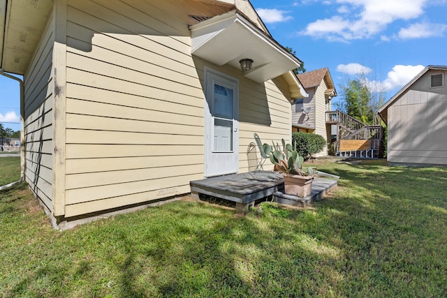 view of home's exterior with a lawn