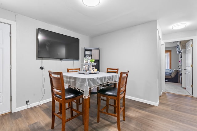 dining area featuring hardwood / wood-style floors