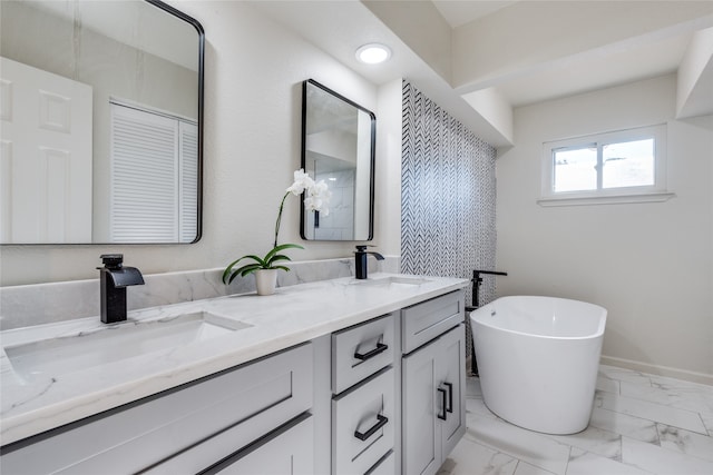 bathroom featuring vanity and a bathing tub