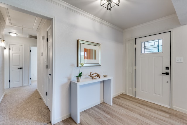 entrance foyer with light wood-type flooring and ornamental molding