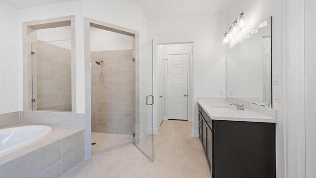 bathroom with vanity, tile patterned floors, and separate shower and tub