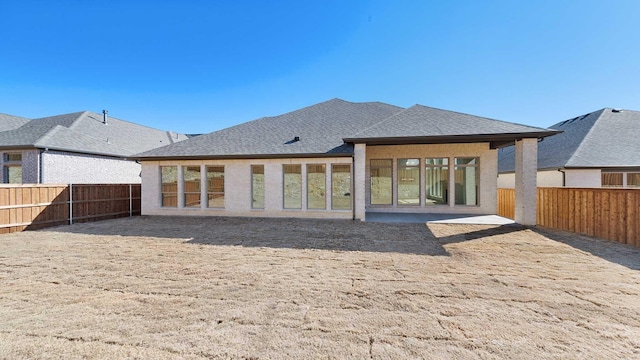 back of house featuring a patio area