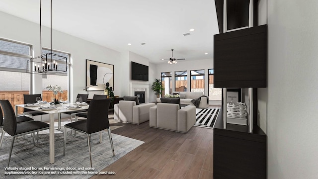 dining space featuring dark wood-type flooring and ceiling fan