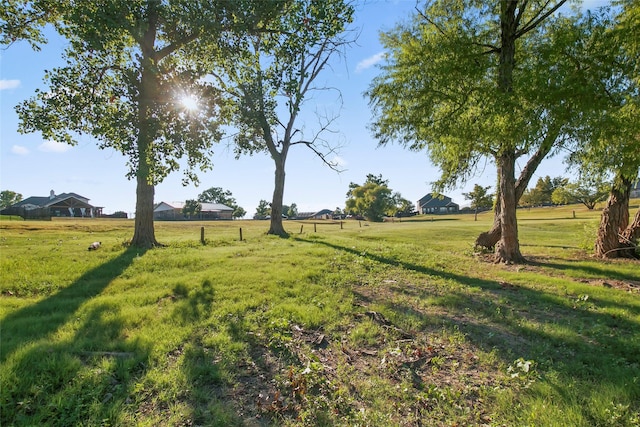 view of yard with a rural view