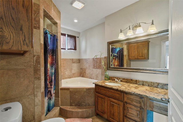 bathroom featuring vanity and separate shower and tub