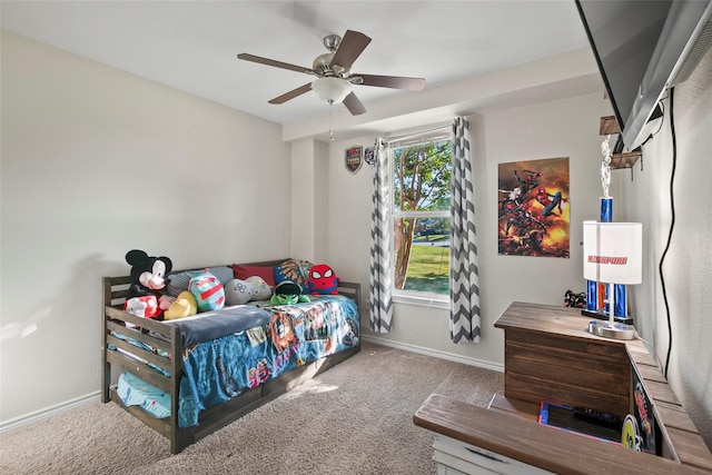 bedroom with ceiling fan and light carpet