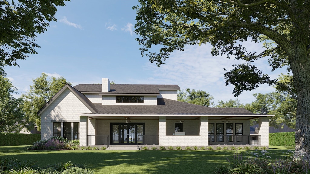 view of front of property with french doors and a front lawn