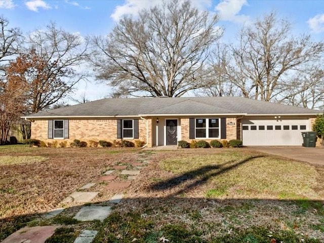 ranch-style house with a garage and a front lawn