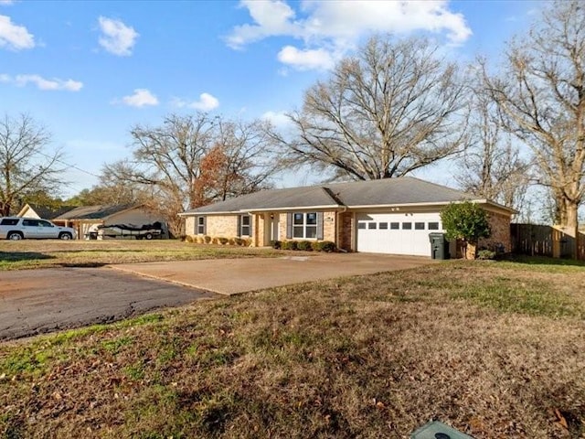 view of front of home featuring a garage and a front yard