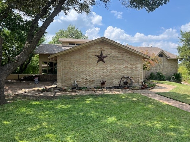 view of home's exterior featuring a yard