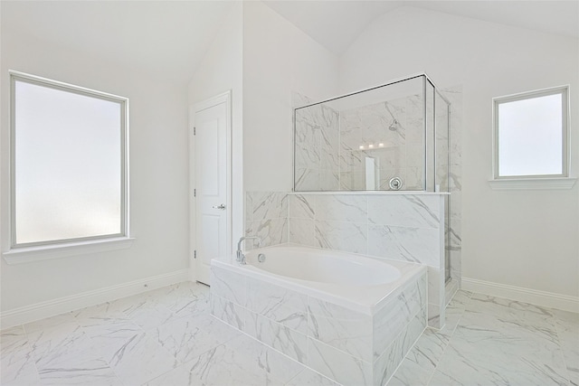 bathroom featuring separate shower and tub and lofted ceiling