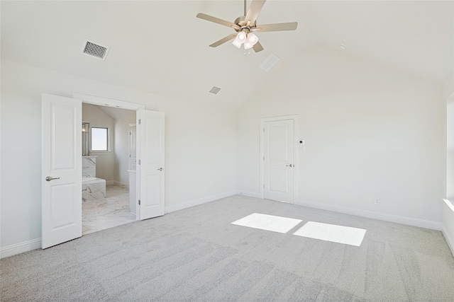 interior space featuring a ceiling fan, visible vents, vaulted ceiling, baseboards, and light colored carpet