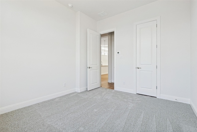 spare room with light carpet