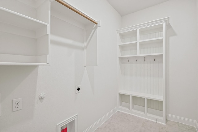 clothes washing area with hookup for an electric dryer and hookup for a gas dryer