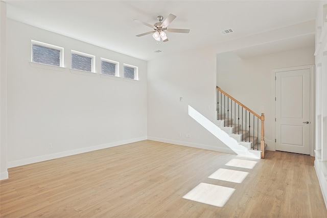 spare room featuring ceiling fan and light hardwood / wood-style flooring