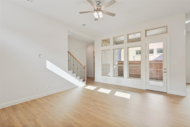 unfurnished room with ceiling fan and light hardwood / wood-style floors