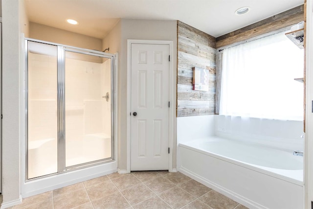 bathroom featuring separate shower and tub and tile patterned floors