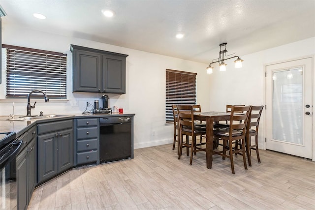 interior space with a textured ceiling, light hardwood / wood-style flooring, and sink