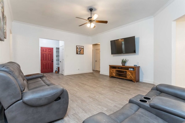 living room featuring ceiling fan, crown molding, and light hardwood / wood-style flooring