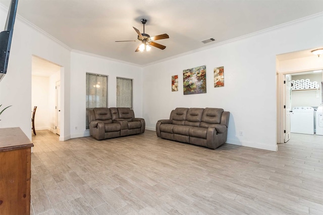 living room featuring light wood-type flooring, crown molding, independent washer and dryer, and ceiling fan