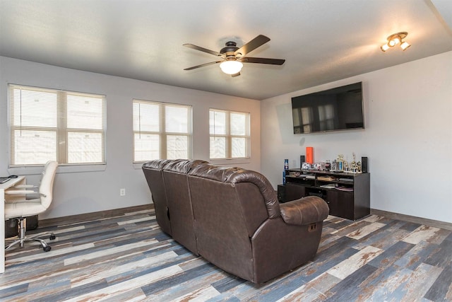 living room featuring hardwood / wood-style floors and ceiling fan