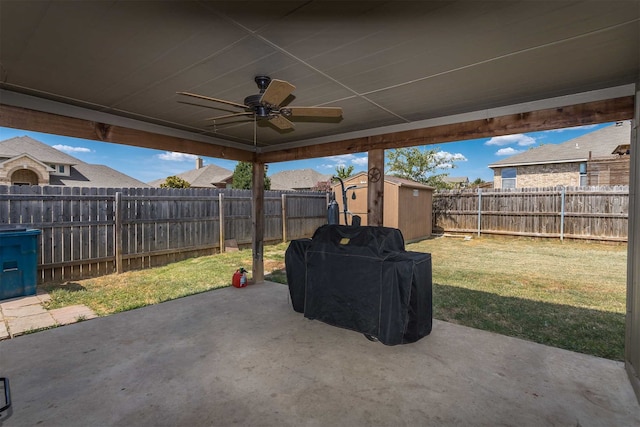 view of patio / terrace featuring ceiling fan and a storage shed