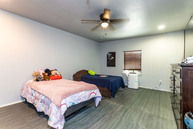 bedroom with hardwood / wood-style flooring and ceiling fan